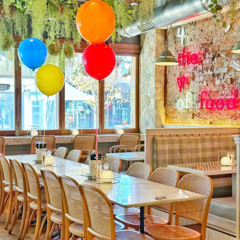 Table setup with birthday balloons at Frankie B's