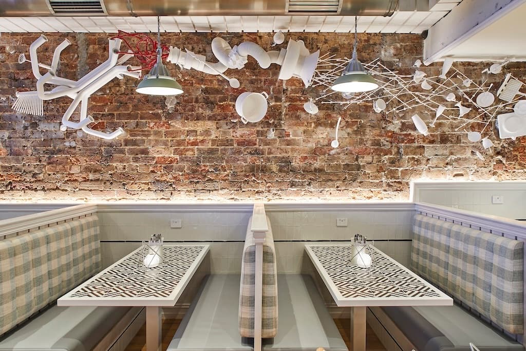 Frankie B's Food House Parramatta Booth Seating with Artistic Wall Decor – cosy and stylish